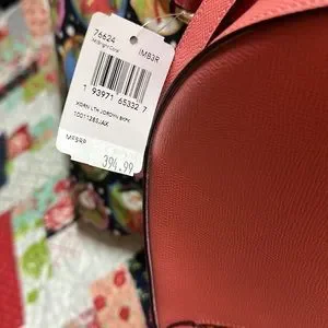 Beautiful Salmon colored Coach backpack. Never used, still has tags attached. i have become that person that brings her kindle everywhere  main image 4